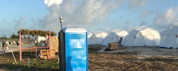 This photo provided by Jake Strang shows tents and a portable toilet set up for attendees for the Fyre Festival, Friday, April 28, 2017 in the Exuma islands, Bahamas. Organizers of the much-hyped music festival in the Bahamas canceled the weekend event at the last minute Friday after many people had already arrived and spent thousands of dollars on tickets and travel. This photo provided by Jake Strang shows tents and a portable toilet set up for attendees for the Fyre Festival, Friday, April 28, 2017 in the Exuma islands, Bahamas. Organizers of the much-hyped music festival in the Bahamas canceled the weekend event at the last minute Friday after many people had already arrived and spent thousands of dollars on tickets and travel. - Sputnik International