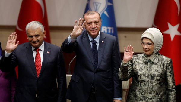 Turkish President Tayyip Erdogan greets his supporters after a speech as he is flanked by his wife Emine Erdogan and Prime Minister Binali Yildirim at the ruling AK Party's headquarters in Ankara, Turkey, May 2, 2017 Turkish President Tayyip Erdogan greets his supporters after a speech as he is flanked by his wife Emine Erdogan and Prime Minister Binali Yildirim at the ruling AK Party's headquarters in Ankara, Turkey, May 2, 2017 - Sputnik International