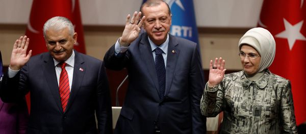 Turkish President Tayyip Erdogan greets his supporters after a speech as he is flanked by his wife Emine Erdogan and Prime Minister Binali Yildirim at the ruling AK Party's headquarters in Ankara, Turkey, May 2, 2017 Turkish President Tayyip Erdogan greets his supporters after a speech as he is flanked by his wife Emine Erdogan and Prime Minister Binali Yildirim at the ruling AK Party's headquarters in Ankara, Turkey, May 2, 2017 - Sputnik International