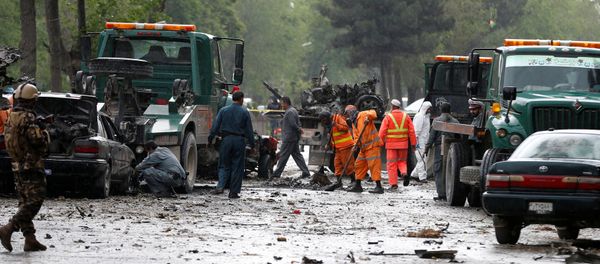 Afghan police and municipal workers clear debris from the site of a suicide bomb attack in Kabul, Afghanistan May 3, 2017 Afghan police and municipal workers clear debris from the site of a suicide bomb attack in Kabul, Afghanistan May 3, 2017 - Sputnik International