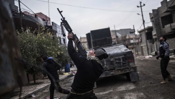 In this Sunday, Dec. 18, 2016 file photo, a member of the Iraqi Special Forces shoots his machine gun against an Islamic State militant drone n the al-Barid district in Mosul, Iraq In this Sunday, Dec. 18, 2016 file photo, a member of the Iraqi Special Forces shoots his machine gun against an Islamic State militant drone n the al-Barid district in Mosul, Iraq - Sputnik International