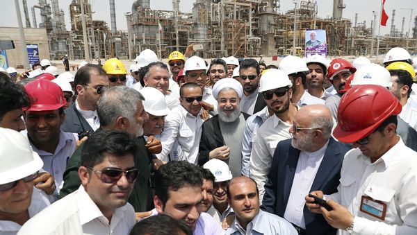 In this photo released by an official website of the office of the Iranian Presidency, Sunday, April 30, 2017, Iranian President Hassan Rouhani, center, inaugurates a new refinery that produces some 12 million liters (3.17 million gallons) of gas in its first phase, in Bandar Abbas, some 750 miles (1,205 kilometers) south of Tehran, Iran In this photo released by an official website of the office of the Iranian Presidency, Sunday, April 30, 2017, Iranian President Hassan Rouhani, center, inaugurates a new refinery that produces some 12 million liters (3.17 million gallons) of gas in its first phase, in Bandar Abbas, some 750 miles (1,205 kilometers) south of Tehran, Iran - Sputnik International