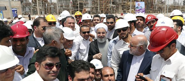 In this photo released by an official website of the office of the Iranian Presidency, Sunday, April 30, 2017, Iranian President Hassan Rouhani, center, inaugurates a new refinery that produces some 12 million liters (3.17 million gallons) of gas in its first phase, in Bandar Abbas, some 750 miles (1,205 kilometers) south of Tehran, Iran In this photo released by an official website of the office of the Iranian Presidency, Sunday, April 30, 2017, Iranian President Hassan Rouhani, center, inaugurates a new refinery that produces some 12 million liters (3.17 million gallons) of gas in its first phase, in Bandar Abbas, some 750 miles (1,205 kilometers) south of Tehran, Iran - Sputnik International