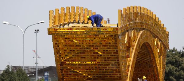 Workers install wires on a 'Golden Bridge of Silk Road' structure on a platform outside the National Convention Center, the venue which will hold the Belt and Road Forum for International Cooperation, in Beijing, April 18, 2017 Workers install wires on a 'Golden Bridge of Silk Road' structure on a platform outside the National Convention Center, the venue which will hold the Belt and Road Forum for International Cooperation, in Beijing, April 18, 2017 - Sputnik International