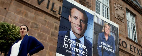 A woman walks near election campaign posters for French centrist presidential candidate Emmanuel Macron, left, and far-right candidate Marine Le Pen, in Saint Jean Pied de Port, southwestern France, Friday May 5, 2017 A woman walks near election campaign posters for French centrist presidential candidate Emmanuel Macron, left, and far-right candidate Marine Le Pen, in Saint Jean Pied de Port, southwestern France, Friday May 5, 2017 - Sputnik International