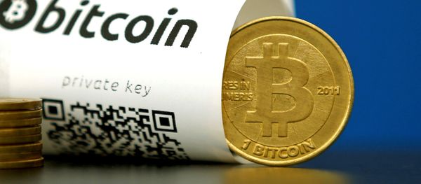 A Bitcoin (virtual currency) paper wallet with QR codes and a coin are seen in an illustration picture taken at La Maison du Bitcoin in Paris, France May 27, 2015 A Bitcoin (virtual currency) paper wallet with QR codes and a coin are seen in an illustration picture taken at La Maison du Bitcoin in Paris, France May 27, 2015 - Sputnik International