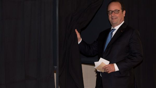 French President Francois Hollande prepares to vote in the second round of 2017 French presidential election at a polling station in Tulle, France French President Francois Hollande prepares to vote in the second round of 2017 French presidential election at a polling station in Tulle, France - Sputnik International