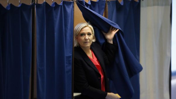 French far-right presidential candidate, Marine Le Pen exits a voting booth before casting her ballot in Henin Beaumont, France French far-right presidential candidate, Marine Le Pen exits a voting booth before casting her ballot in Henin Beaumont, France - Sputnik International