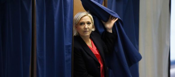 French far-right presidential candidate, Marine Le Pen exits a voting booth before casting her ballot in Henin Beaumont, France - Sputnik International