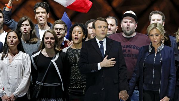 French President elect Emmanuel Macron and his wife Brigitte Trogneux celebrate on the stage at his victory rally near the Louvre in Paris, France May 7, 2017. - Sputnik International