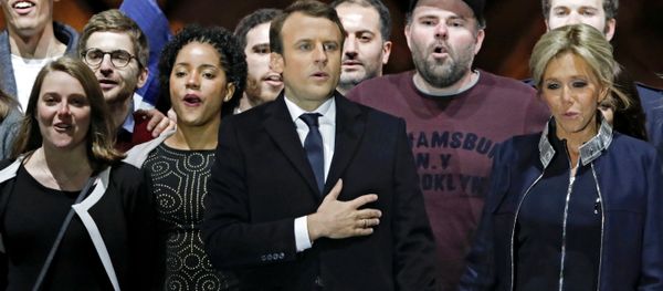 French President elect Emmanuel Macron and his wife Brigitte Trogneux celebrate on the stage at his victory rally near the Louvre in Paris, France May 7, 2017. French President elect Emmanuel Macron and his wife Brigitte Trogneux celebrate on the stage at his victory rally near the Louvre in Paris, France May 7, 2017. - Sputnik International