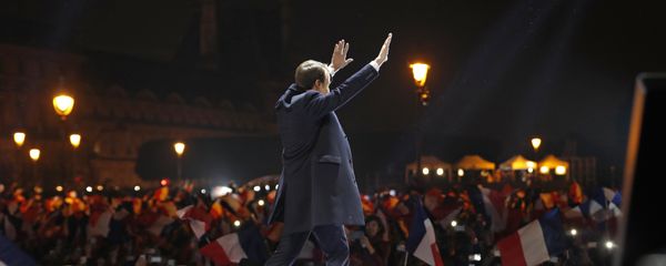 French president-elect Emmanuel Macron waves at supporters as he arrives on stage before delivering a speech in front of the Pyramid at the Louvre Museum in Paris on May 7, 2017, after the second round of the French presidential election. - Sputnik International