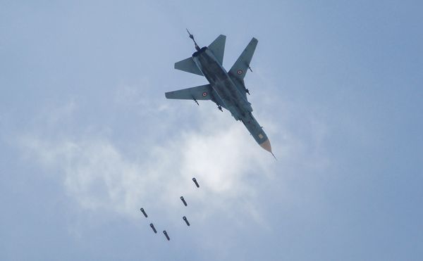 A Syrian government forces' MiG-23 fighter-bomber drops a payload during a reported air strike in the rebel-held area of Qabun, east of the capital Damascus, on May 6, 2017. - Sputnik International