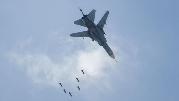 A Syrian government forces' MiG-23 fighter-bomber drops a payload during a reported air strike in the rebel-held area of Qabun, east of the capital Damascus, on May 6, 2017. - Sputnik International