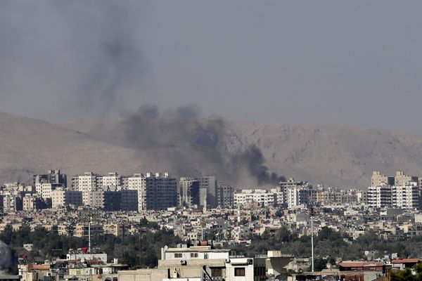 This Friday, August 23, 2013 file photo, black columns of smoke from heavy shelling in Barzeh, a suburb of Damascus, Syria. This Friday, August 23, 2013 file photo, black columns of smoke from heavy shelling in Barzeh, a suburb of Damascus, Syria. - Sputnik International