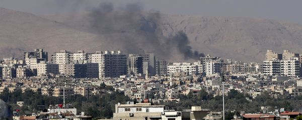 This Friday, August 23, 2013 file photo, black columns of smoke from heavy shelling in Barzeh, a suburb of Damascus, Syria. This Friday, August 23, 2013 file photo, black columns of smoke from heavy shelling in Barzeh, a suburb of Damascus, Syria. - Sputnik International