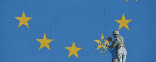A section of an artwork attributed to street artist Banksy, depicting a workman chipping away at one of the 12 stars on the flag of the European Union, is seen on a wall in the ferry port of Dover. A section of an artwork attributed to street artist Banksy, depicting a workman chipping away at one of the 12 stars on the flag of the European Union, is seen on a wall in the ferry port of Dover. - Sputnik International