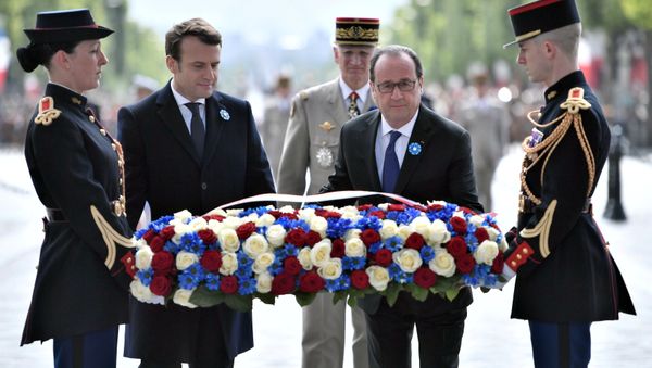 Outgoing French President Francois Hollande (R) and President-elect Emmanuel Macron attend a ceremony to mark the end of World War II at the Tomb of the Unknown Soldier at the Arc de Triomphe in Paris, France, May 8, 2017. Outgoing French President Francois Hollande (R) and President-elect Emmanuel Macron attend a ceremony to mark the end of World War II at the Tomb of the Unknown Soldier at the Arc de Triomphe in Paris, France, May 8, 2017. - Sputnik International