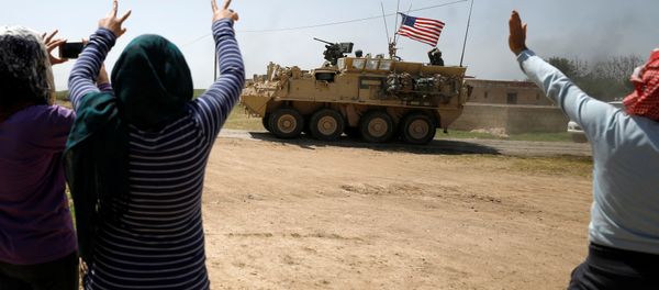 People gesture at a US military vehicle travelling in Amuda province, northern Syria April 29, 2017. People gesture at a US military vehicle travelling in Amuda province, northern Syria April 29, 2017. - Sputnik International