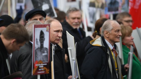 Russian President Vladimir Putin attends Immortal Regiment march during Victory Day celebrations, marking 72nd anniversary of victory over Nazi Germany in World War Two, at Red Square in central Moscow - Sputnik International