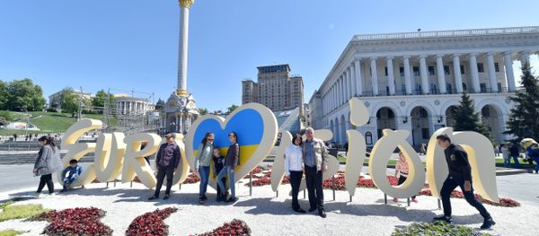 People pose for pictures in front of the official logo for the Eurovision Song Contest on Independence Square in Kiev on May 3, 2017. People pose for pictures in front of the official logo for the Eurovision Song Contest on Independence Square in Kiev on May 3, 2017. - Sputnik International
