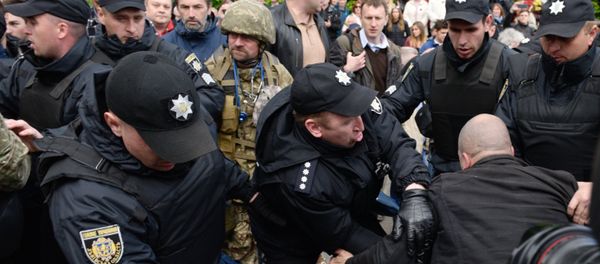 Ukrainian riot police officers block supporters of far-right parties who tried to prevent the Immortal Regiment march, during the Victory Day celebrations in Kiev, Ukraine Ukrainian riot police officers block supporters of far-right parties who tried to prevent the Immortal Regiment march, during the Victory Day celebrations in Kiev, Ukraine - Sputnik International
