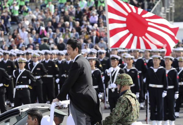 Japanese Prime Minister Shinzo Abe, center standing, reviews members of Japan Self-Defense Forces (SDF) during the Self-Defense Forces Day at Asaka Base, north of Tokyo, Sunday, Oct. 23, 2016.  - Sputnik International