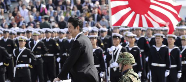 Japanese Prime Minister Shinzo Abe, center standing, reviews members of Japan Self-Defense Forces (SDF) during the Self-Defense Forces Day at Asaka Base, north of Tokyo, Sunday, Oct. 23, 2016. Japanese Prime Minister Shinzo Abe, center standing, reviews members of Japan Self-Defense Forces (SDF) during the Self-Defense Forces Day at Asaka Base, north of Tokyo, Sunday, Oct. 23, 2016. - Sputnik International