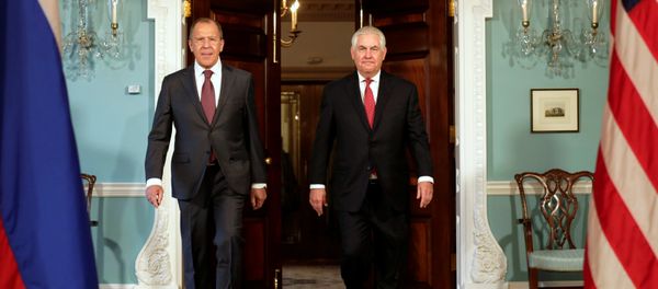 U.S. Secretary of State Rex Tillerson (R) walks with Russian Foreign Minister Sergey Lavrov before their meeting at the State Department in Washington, U.S - Sputnik International