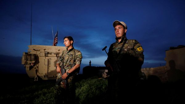Kurdish fighters from the People's Protection Units (YPG) stand near a U.S military vehicle in the town of Darbasiya near the Turkish border, Syria April 28, 2017 Kurdish fighters from the People's Protection Units (YPG) stand near a U.S military vehicle in the town of Darbasiya near the Turkish border, Syria April 28, 2017 - Sputnik International