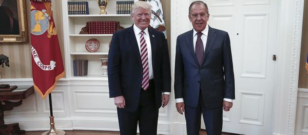 A handout photo made available by the Russian Foreign Ministry on May 10, 2017 shows US President Donald J. Trump (L) posing with Russian Foreign Minister Sergei Lavrov during a meeting at the White House in Washington, DC. - Sputnik International