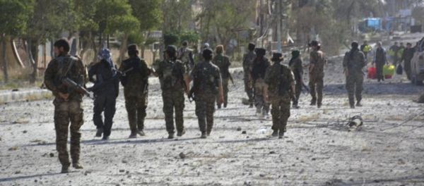 In this undated photo released Thursday, May 11, 2017, by Hawar News, the news agency for the semi-autonomous Kurdish areas in Syria, shows fighters from the Kurdish-led Syria Democratic Forces, patrolling on a street in Tabqa, northern Syria In this undated photo released Thursday, May 11, 2017, by Hawar News, the news agency for the semi-autonomous Kurdish areas in Syria, shows fighters from the Kurdish-led Syria Democratic Forces, patrolling on a street in Tabqa, northern Syria - Sputnik International