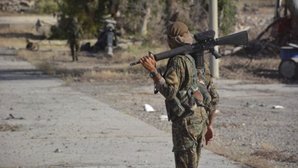 In this undated photo released Thursday, May 11, 2017, by Hawar News, the news agency for the semi-autonomous Kurdish areas in Syria, shows fighters from the Kurdish-led Syria Democratic Forces, patrolling on a street in Tabqa, northern Syria - Sputnik International