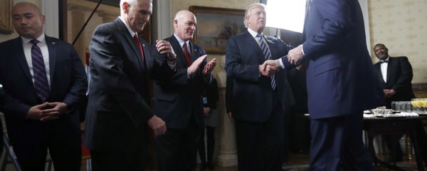 Vice President Mike Pence, second from left, and Secret Service Director Joseph Clancy stand as President Donald Trump shakes hands with FBI Director James Comey during a reception for inaugural law enforcement officers and first responders in the Blue Room of the White House, Sunday, Jan. 22, 2017 in Washington Vice President Mike Pence, second from left, and Secret Service Director Joseph Clancy stand as President Donald Trump shakes hands with FBI Director James Comey during a reception for inaugural law enforcement officers and first responders in the Blue Room of the White House, Sunday, Jan. 22, 2017 in Washington - Sputnik International
