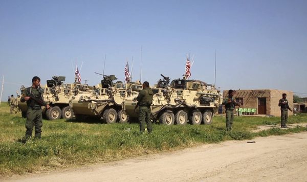 This Saturday, April. 29, 2017 still taken from video, shows Kurdish fighters of the People's Protection Units (YPG) standing guard as U.S. forces take up positions in the northern village of Darbasiyah, Syria - Sputnik International