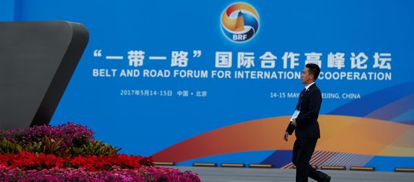 A man walks past the China National Convention Center, a venue of the upcoming Belt and Road Forum in Beijing, China, May 12, 2017 A man walks past the China National Convention Center, a venue of the upcoming Belt and Road Forum in Beijing, China, May 12, 2017 - Sputnik International