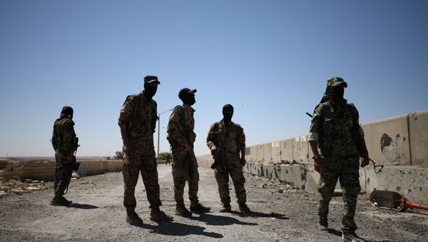 Syrian Democratic Forces (SDF) fighters stand in the town of Tabqa, after capturing it from Islamic State militants this week, Syria May 12, 2017 - Sputnik International