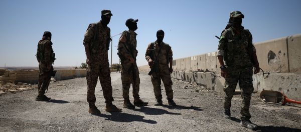 Syrian Democratic Forces (SDF) fighters stand in the town of Tabqa, after capturing it from Islamic State militants this week, Syria May 12, 2017 Syrian Democratic Forces (SDF) fighters stand in the town of Tabqa, after capturing it from Islamic State militants this week, Syria May 12, 2017 - Sputnik International