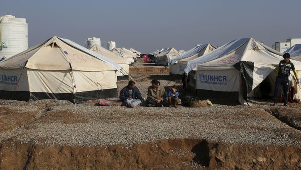 Displaced Iraqis, who fled fighting between Iraqi security forces and Islamic State militants, sit at the Hassan Sham camp, east of Mosul, Iraq, Monday, Jan. 23, 2017 Displaced Iraqis, who fled fighting between Iraqi security forces and Islamic State militants, sit at the Hassan Sham camp, east of Mosul, Iraq, Monday, Jan. 23, 2017 - Sputnik International