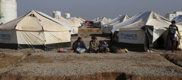 Displaced Iraqis, who fled fighting between Iraqi security forces and Islamic State militants, sit at the Hassan Sham camp, east of Mosul, Iraq, Monday, Jan. 23, 2017 Displaced Iraqis, who fled fighting between Iraqi security forces and Islamic State militants, sit at the Hassan Sham camp, east of Mosul, Iraq, Monday, Jan. 23, 2017 - Sputnik International