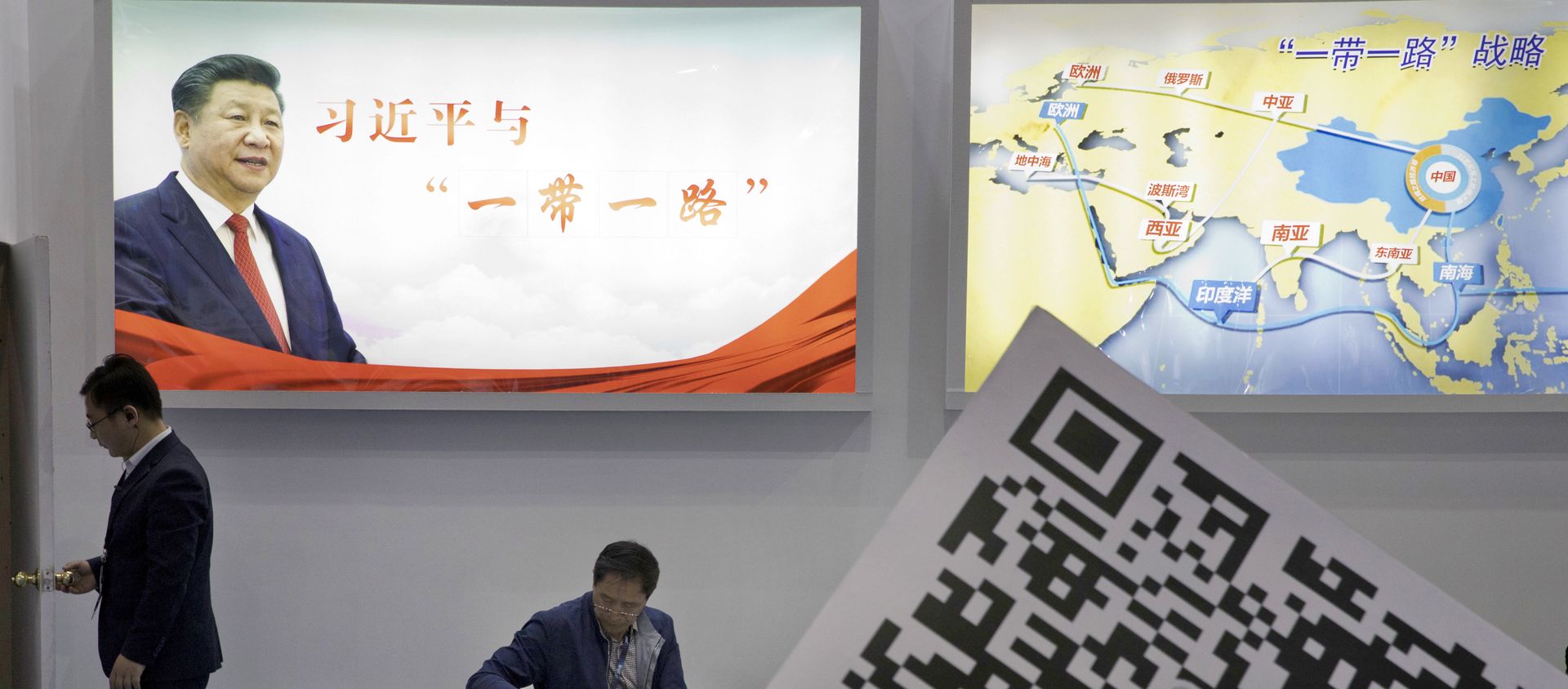 Visitors at a technology conference wait near illuminated boards highlighting Chinese President Xi Jinping's signature One Belt, One Road foreign policy plan in Beijing, China, Friday, April 28, 2017 Visitors at a technology conference wait near illuminated boards highlighting Chinese President Xi Jinping's signature One Belt, One Road foreign policy plan in Beijing, China, Friday, April 28, 2017 - Sputnik International, 1920, 29.01.2021