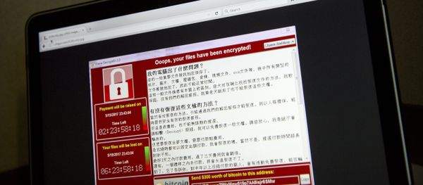 A screenshot of the warning screen from a purported ransomware attack, as captured by a computer user in Taiwan, is seen on laptop in Beijing, Saturday, May 13, 2017 A screenshot of the warning screen from a purported ransomware attack, as captured by a computer user in Taiwan, is seen on laptop in Beijing, Saturday, May 13, 2017 - Sputnik International