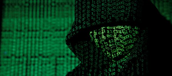 A projection of cyber code on a hooded man is pictured in this illustration picture taken on May 13, 2017 A projection of cyber code on a hooded man is pictured in this illustration picture taken on May 13, 2017 - Sputnik International