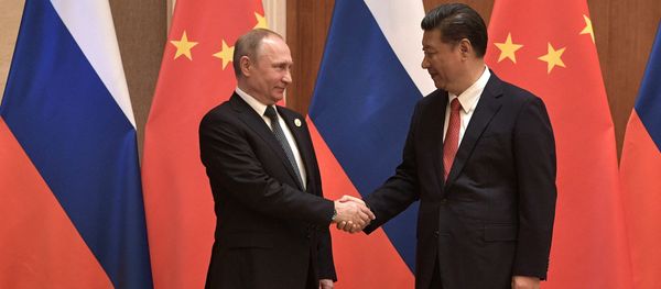 President Vladimir Putin and President of China Xi Jinping, right, during the Russia-China talks at the One Belt, One Road international forum - Sputnik International