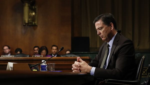 In this Wednesday, May 3, 2017, photo then-FBI Director James Comey pauses as he testifies on Capitol Hill in Washington, before a Senate Judiciary Committee hearing In this Wednesday, May 3, 2017, photo then-FBI Director James Comey pauses as he testifies on Capitol Hill in Washington, before a Senate Judiciary Committee hearing - Sputnik International