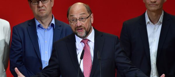 Social Democratic Party (SPD) leader Martin Schulz (C) speaks after the publication of the preliminary results of the regional elections in the West German state of North Rhine-Westphalia at the headquarters of the SPD in Berlin on May 14, 2017 Social Democratic Party (SPD) leader Martin Schulz (C) speaks after the publication of the preliminary results of the regional elections in the West German state of North Rhine-Westphalia at the headquarters of the SPD in Berlin on May 14, 2017 - Sputnik International