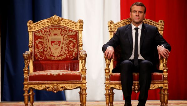 French President Emmanuel Macron listens as Paris Mayor Anne Hidalgo delivers her speech during a ceremony at the Hotel de Ville in Paris, France, May 14, 2017. - Sputnik International