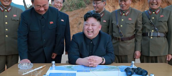 North Korean leader Kim Jong Un reacts during the long-range strategic ballistic rocket Hwasong-12 (Mars-12) test launch in this undated photo released by North Korea's Korean Central News Agency (KCNA) on May 15, 2017. - Sputnik International