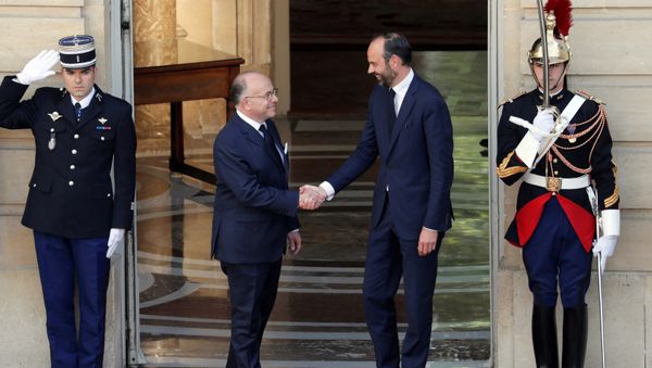 Newly-appointed French Prime Minister Edouard Philippe (R) is greeted by his predecessor Bernard Cazeneuve (L) during a handover ceremony at the Hotel Matignon, in Paris, France, May 15, 2017. Newly-appointed French Prime Minister Edouard Philippe (R) is greeted by his predecessor Bernard Cazeneuve (L) during a handover ceremony at the Hotel Matignon, in Paris, France, May 15, 2017. - Sputnik International