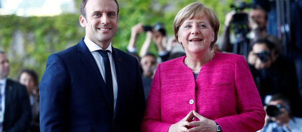 German Chancellor Angela Merkel and French President Emmanuel Macron arrive at a ceremony at the Chancellery in Berlin, Germany, May 15, 2017. German Chancellor Angela Merkel and French President Emmanuel Macron arrive at a ceremony at the Chancellery in Berlin, Germany, May 15, 2017. - Sputnik International